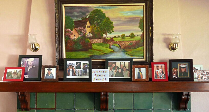 Journey House mantle showing family photos