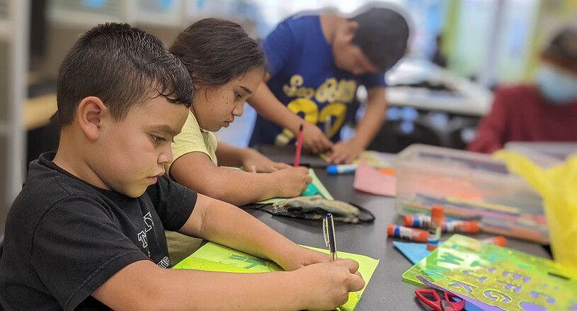 School on Wheels students studying